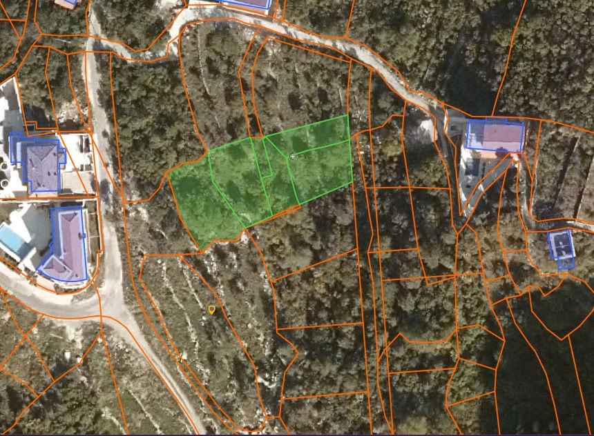 Building plot in Blizikuće, Montenegro: satellite view with highlighted property boundaries.