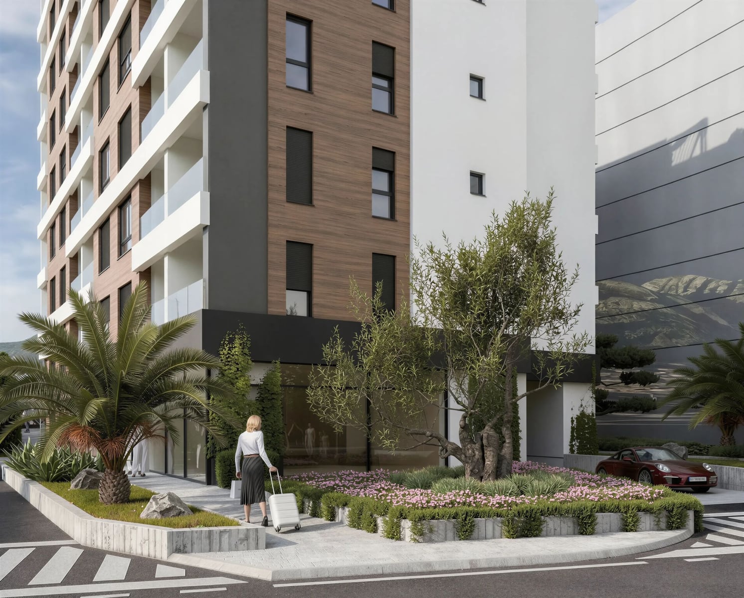 Modern residential complex in Bar, Montenegro: facade with panoramic balconies, landscaping, and parking.