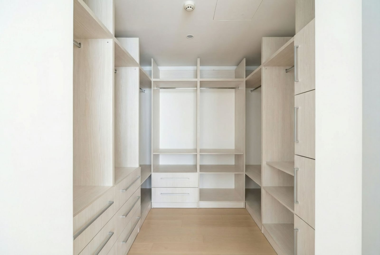 Spacious walk-in closet with light finishes in an apartment at Dukley, Budva, Montenegro.