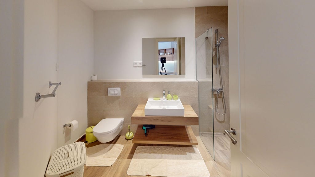 Modern bathroom with a shower cabin in an apartment, Luštica, Montenegro: stylish finishes and fixtures.