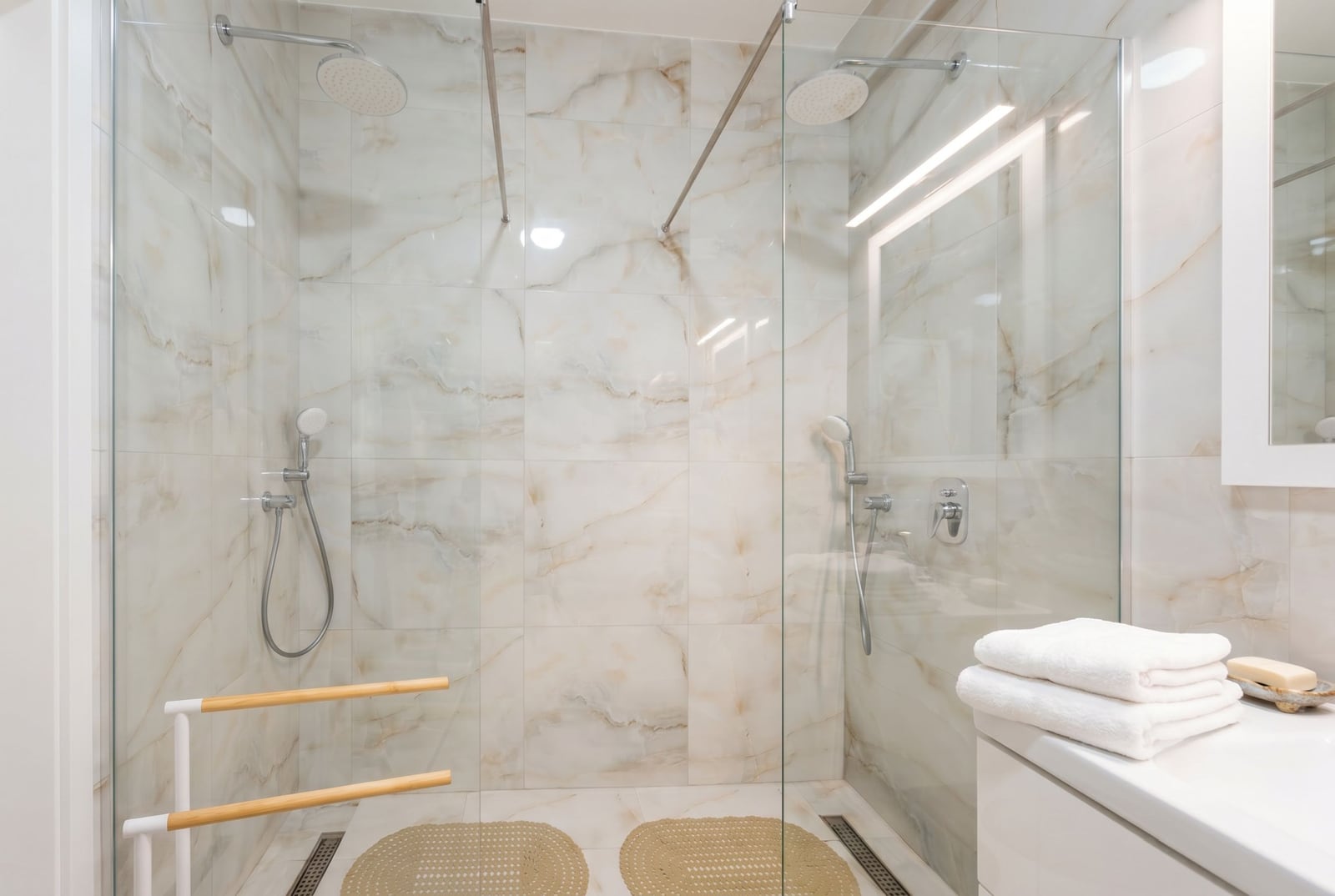 Modern bathroom with a walk-in shower and marble-style finishes in an apartment, Tivat, Montenegro.