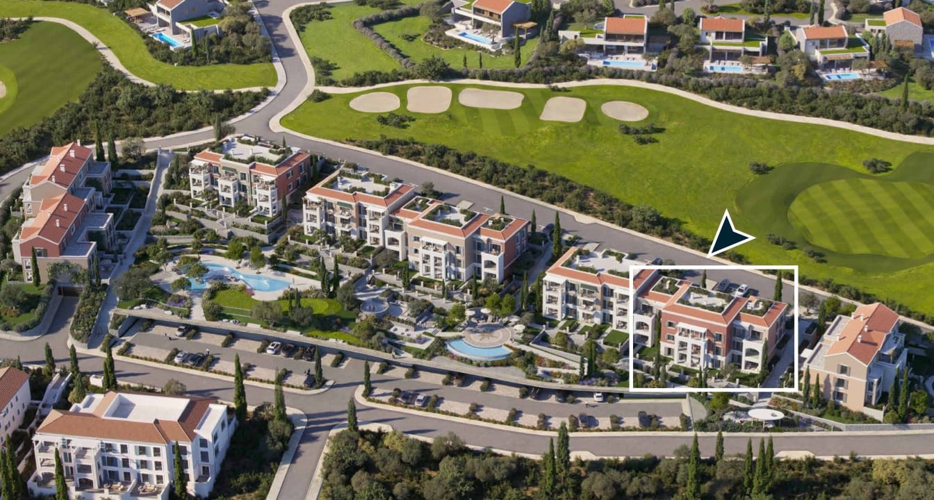 Aerial view of a luxury residential complex in Luštica, Montenegro: modern villas, swimming pools, and a golf course.