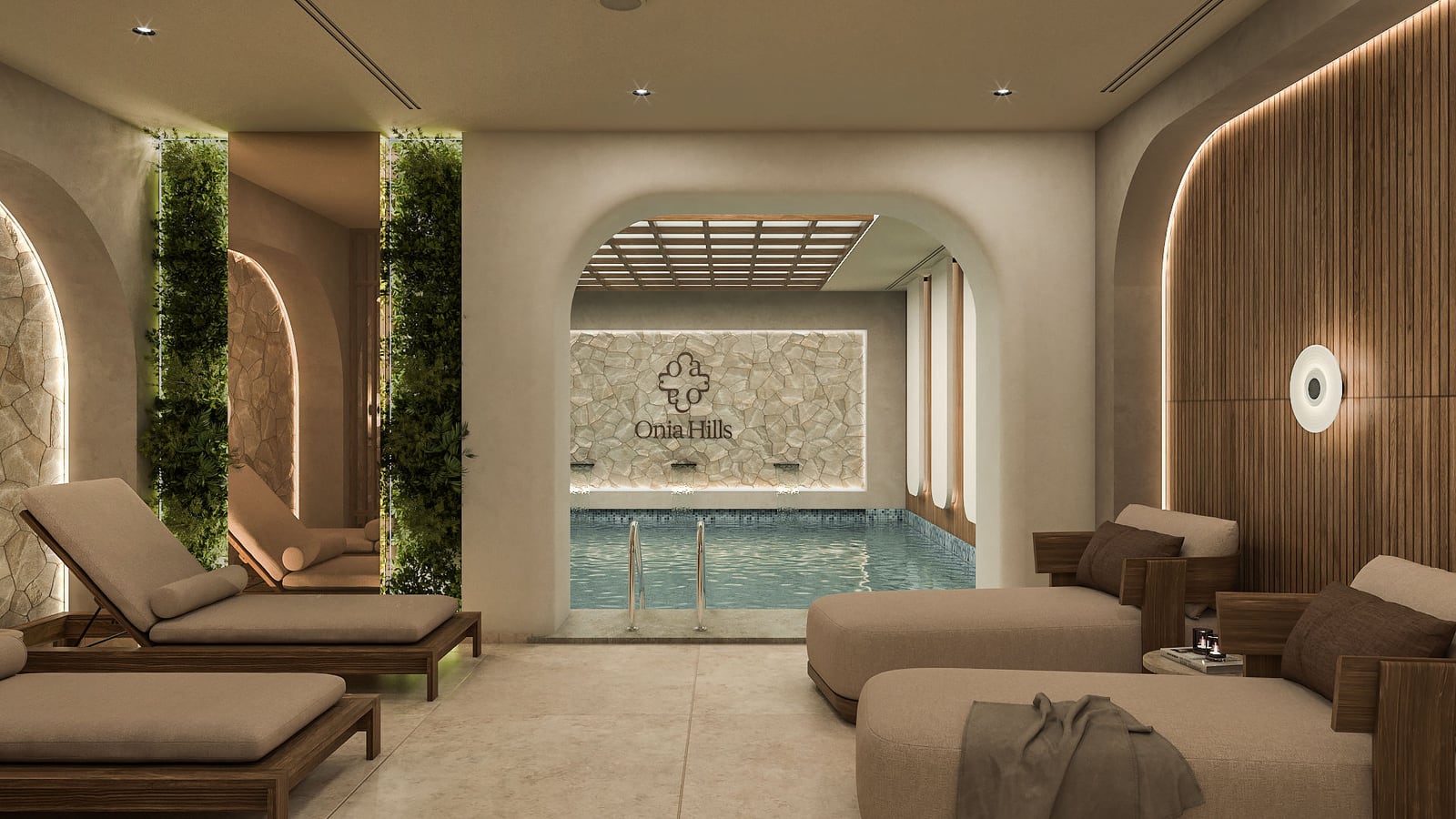 Indoor pool area with lounge chairs, a stone logo wall, and vertical green plant panels.