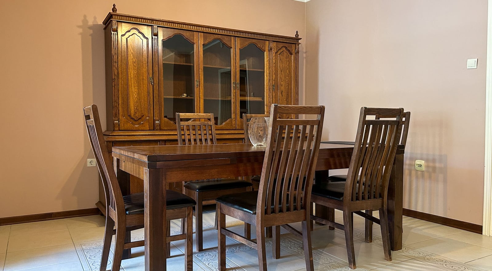 Classic dining area with a wooden set in the living room of a house in Dobrota, Montenegro.