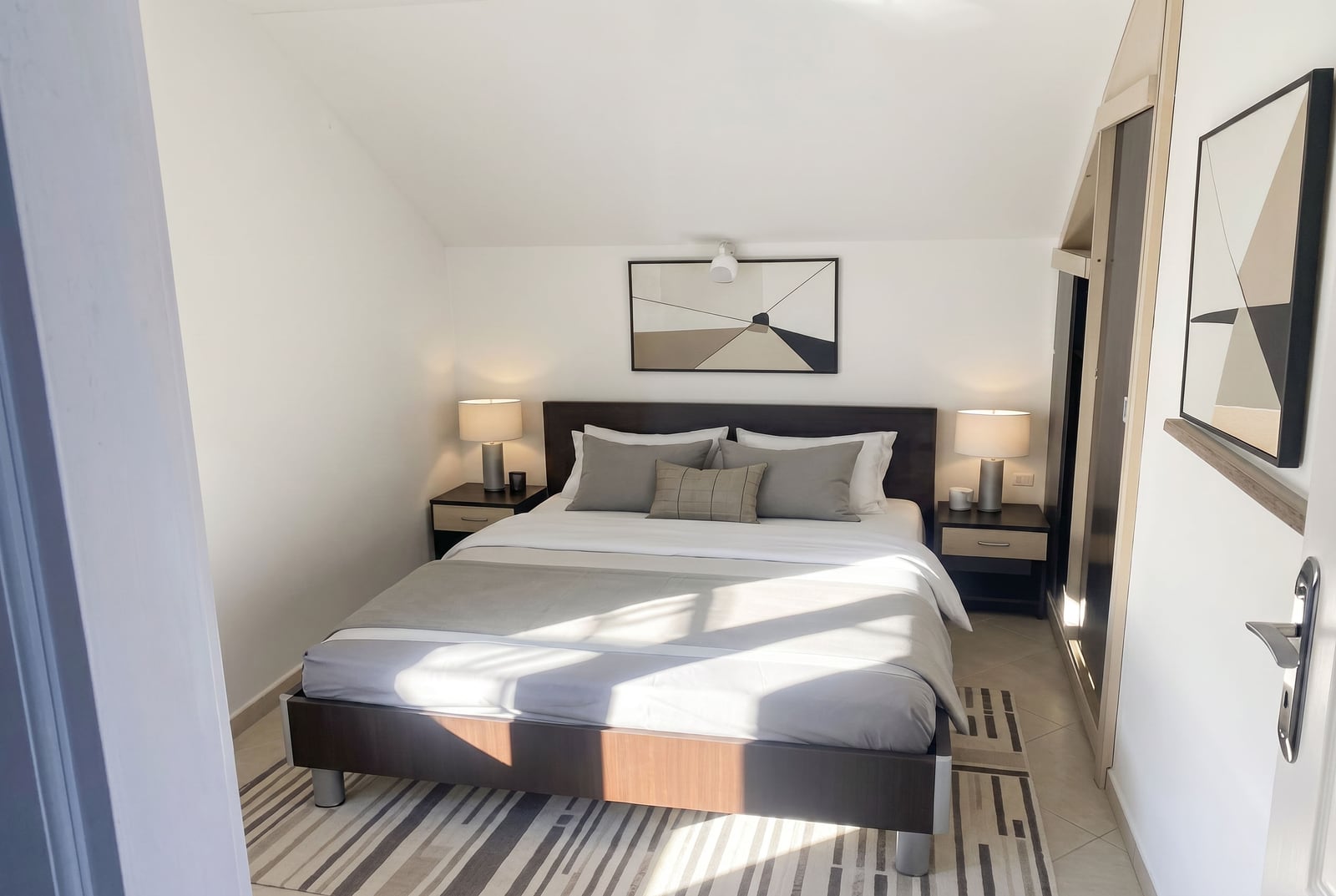 Cozy bedroom with a double bed in a house, Krasici, Montenegro: modern furniture, bright interior, and decor.
