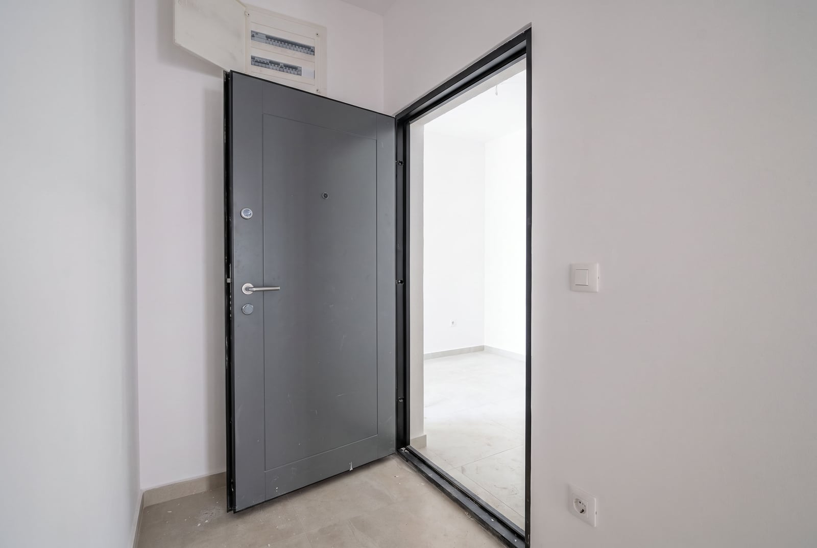 Metal entrance door and light finish in a new apartment in Bar, Montenegro